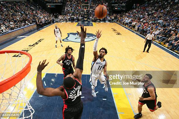 Mike Conley of the Memphis Grizzlies drives to the basket and shoots the ball against the Toronto Raptors on January 25, 2017 at FedExForum in...
