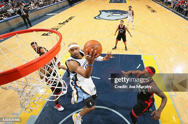 Vince Carter of the Memphis Grizzlies drives to the basket and shoots the ball against the Toronto Raptors on January 25, 2017 at FedExForum in...