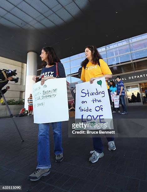 People protesting U.S. President Donald Trump's travel ban greet travelers at The Bradley International Terminal at LAX Airport on January 30, 2017...