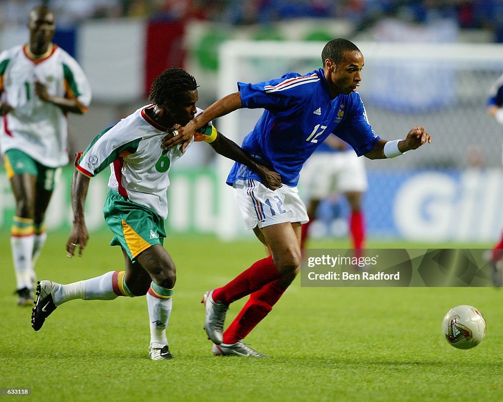 Thierry Henry and Aliou Cisse