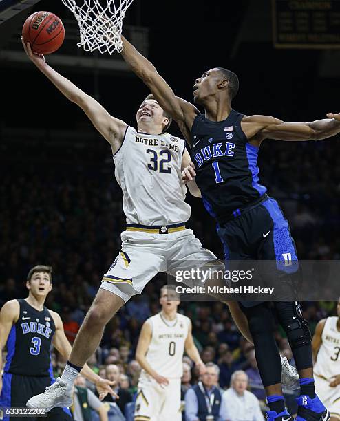 Steve Vasturia of the Notre Dame Fighting Irish shoots the ball as Harry Giles of the Duke Blue Devils defends at Purcell Pavilion on January 30,...