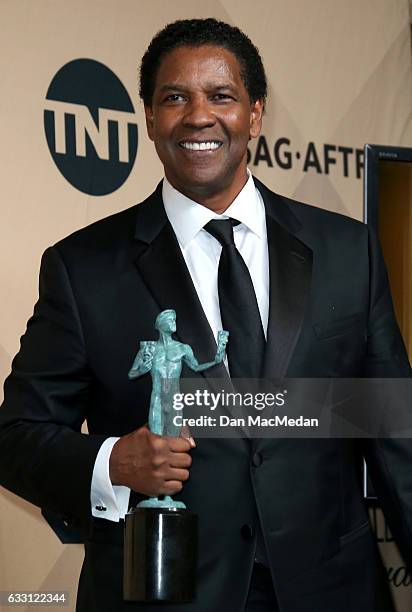 Denzel Washington poses in the press room with his award for Outstanding Performance by a Male Actor in a Leading Role for 'Fences' at the 23rd...