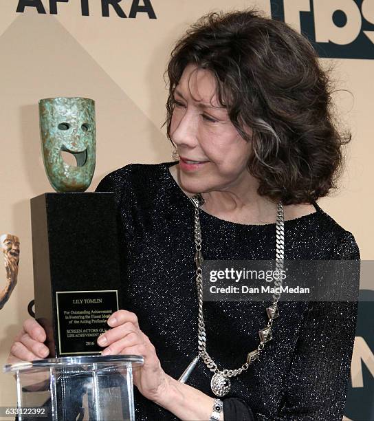 Actress Lily Tomlin poses in the press room with her award for Lifetime Achievement at the 23rd Annual Screen Actors Guild Awards at The Shrine Expo...