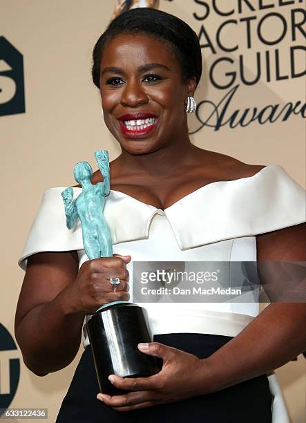 Uzo Aduba poses in the press room with her award for Outstanding Performance by an Ensemble in a Comedy Series for 'Orange Is The New Black' at the...