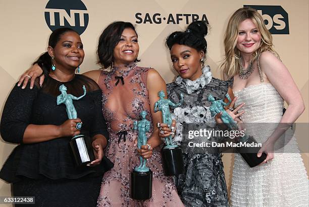 Octavia Spencer, Taraji P. Henson, Janelle Monae and Kirsten Dunst pose in the press room with their award for Outstanding Performance by a Cast in a...