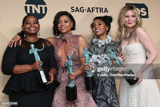 Octavia Spencer, Taraji P. Henson, Janelle Monae and Kirsten Dunst pose in the press room with their award for Outstanding Performance by a Cast in a...