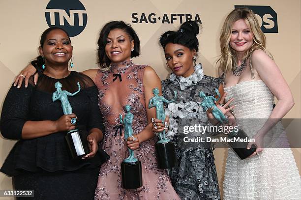 Octavia Spencer, Taraji P. Henson, Janelle Monae and Kirsten Dunst pose in the press room with their award for Outstanding Performance by a Cast in a...