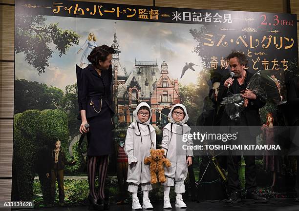 Film director Tim Burton speaks next to Japanese actress Airi Matsui and Japanese four-year-old twin models, Rinka and Anna , all dressed like...