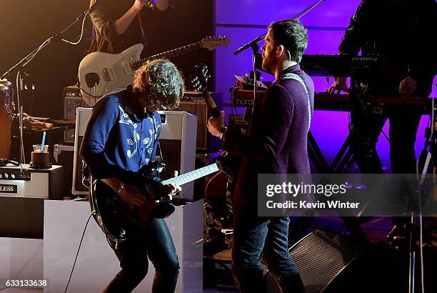 Matthew Followill and Caleb Followill of Kings Of Leon perform on stage on AT&T at iHeartRadio Theater LA on January 30, 2017 in Burbank, California.