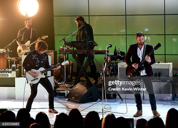 Matthew Followill and Caleb Followill of Kings Of Leon perform on stage on AT&T at iHeartRadio Theater LA on January 30, 2017 in Burbank, California.