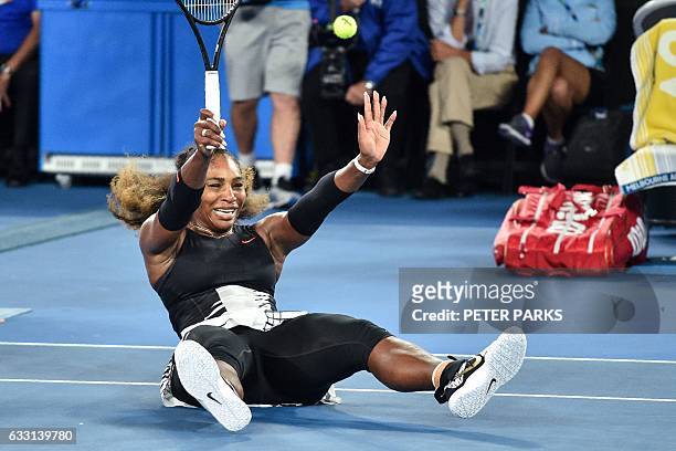 Serena Williams of the US celebrates her victory against Venus Williams of the US during the women's singles final on day 13 of the Australian Open...