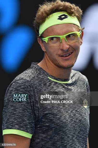 Uzbekistan's Denis Istomin reacts after a point against Serbia's Novak Djokovic during their men's singles second round match on day four of the...