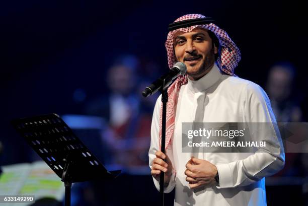 Saudi singer Majid al-Muhandis performs during a concert in Jeddah on January 30, 2017. Saudi Arabia's "Paul McCartney" took to the stage as the...