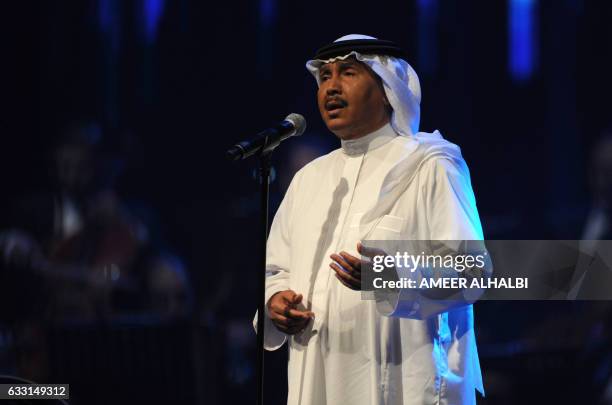 Saudi singer Mohammed Abdu performs during a concert in Jeddah on January 30, 2017. Saudi Arabia's "Paul McCartney" took to the stage as the kingdom...