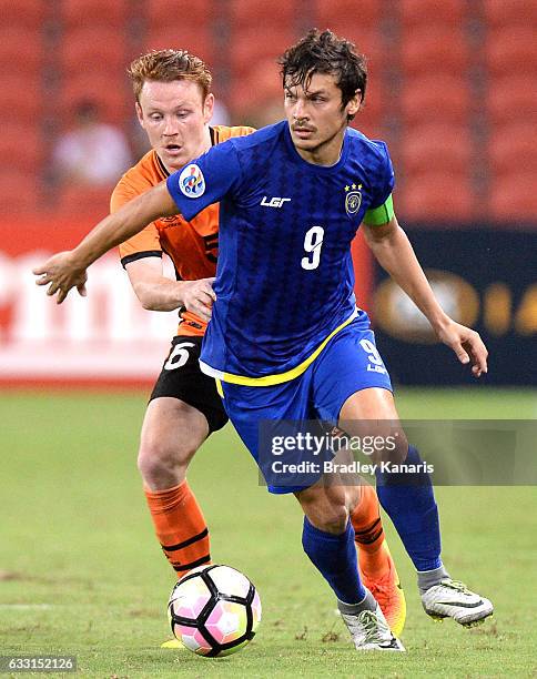 Misagh Bahadoran of Global FC is challenged by Corey Brown of the Roar during the Asian Cup Champions League Qualifying Match between Brisbane Roar...