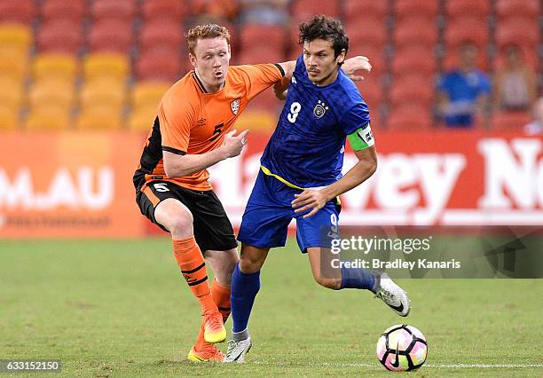 Misagh Bahadoran of Global FC is challenged by Corey Brown of the Roar during the Asian Cup Champions League Qualifying Match between Brisbane Roar...