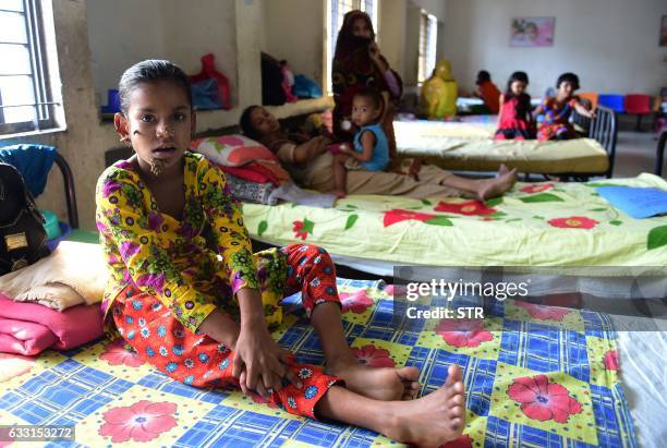 In this photograph taken on January 30 Bangladeshi patient Sahana Khatun poses for a photograph at the Dhaka Medical College and Hospital. A young...