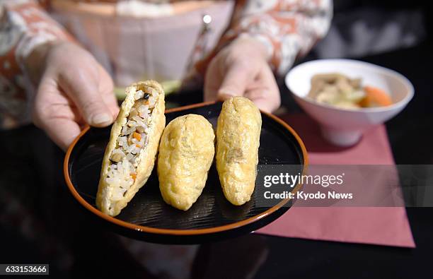 Photo taken Jan. 27 shows fried tofu stuffed with boiled rice, or "inari-zushi," which is described as "a dish fit for the gods." It is served at a...