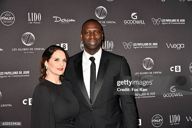 Helene Sy and Globes de Cristal awarded actor Omar Sy attend Les Globes de Cristal Awards 11th Ceremony at Lido on January 30, 2017 in Paris, France.