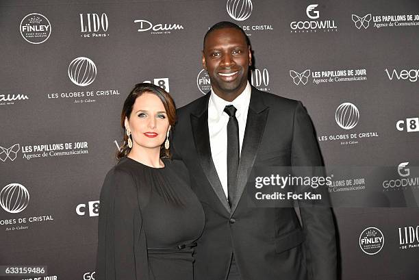 Helene Sy and Globes de Cristal awarded actor Omar Sy attend Les Globes de Cristal Awards 11th Ceremony at Lido on January 30, 2017 in Paris, France.