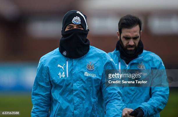 Isaac Hayden walks outside with a snood over his face for the Newcastle United Training Session at The Newcastle United Training Centre on January...