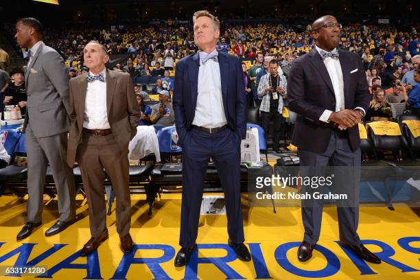 Ron Adams, Steve Kerr and Mike Brown of the Golden State Warriors stand on the court before the game against the Los Angeles Clippers on January 28,...