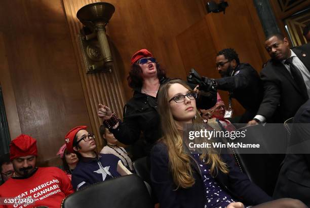 Protester is led away by U.S. Capitol Police after disrupting the Senate Judiciary Committee's 'markup' on the nomination of Sen. Jeff Sessions to be...