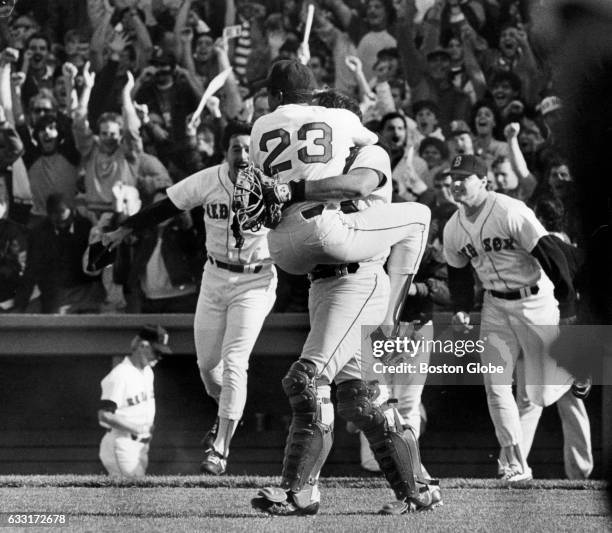 Boston Red Sox pitcher Dennis "Oil Can" Boyd celebrates in the arms of catcher Rich Gedman after defeating the Toronto Blue Jays to clinch the...