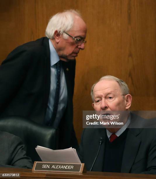 Chairman Lamar Alexander , speaks while Sen. Bernie Sanders walks away, during a Senate Health, Education, Labor and Pensions committee hearing on...