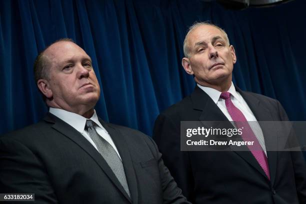 Immigration and Customs Enforcement Acting Director Thomas Homan and Secretary of Homeland Security John Kelly listen to questions during a press...