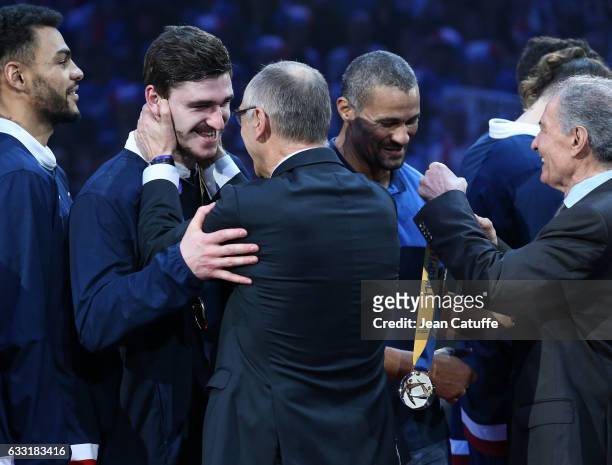 Ludovic Fabregas and coach of France Didier Dinart receive their gold medals from FFH President Joel Delplanque and IHF President Hassan Moustafa...