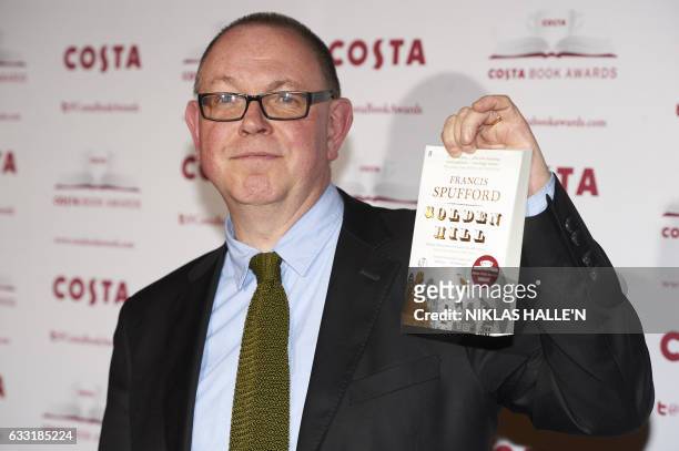 British author Francis Spufford poses with his First Novel Award winning book 'Golden Hill' as he arrives for the 2016 Costa Book Awards in London on...