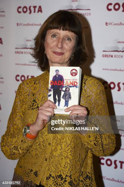 British author Keggie Carew poses with her Biography Award winning book 'Dadland' as she arrives for the 2016 Costa Book Awards in London on January...