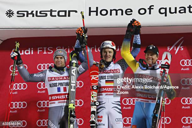 Alexis Pinturault of France takes 2nd place, Linus Strasser of Germany takes 1st place, Mattias Hargin of Sweden takes 3rd place during the Audi FIS...