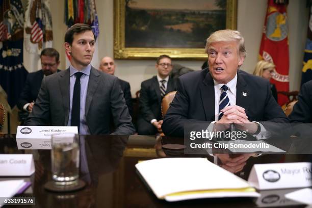 President Donald Trump delivers remarks at the beginning of a meeting with his son-in-law and Senior Advisor Jared Kushner and government cyber...