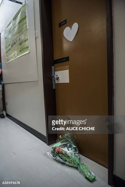 Flowers are placed in honor of Professor Khaled Belkacemi, one of the six shooting victims on the campus of Laval University on January 31, 2017 in...