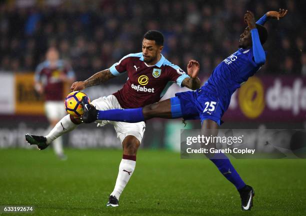 Andre Gray of Burnley and Wilfred Ndidi of Leicester City compete for the ball during the Premier League match between Burnley and Leicester City at...