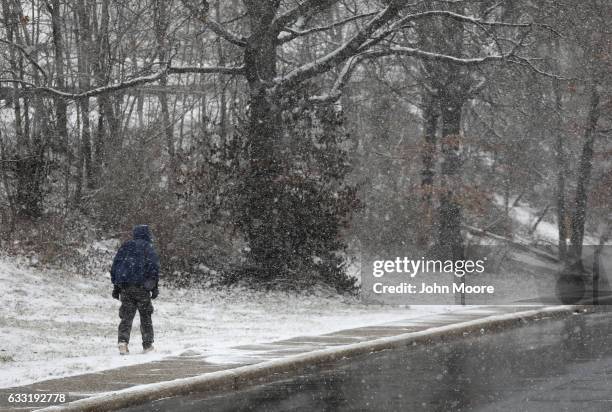 An immigrant walks from a day labor pick-up site on January 31, 2017 in Stamford, Connecticut. The city of Stamford has an official zone for...