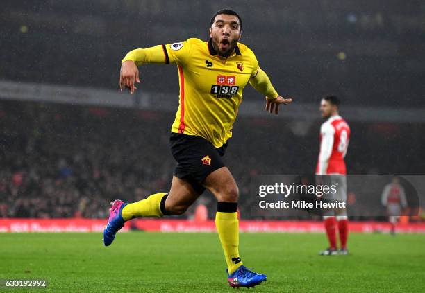 Troy Deeney of Watford celebrates scoring his team's second goal during the Premier League match between Arsenal and Watford at Emirates Stadium on...