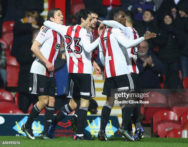 Lasse Vibe of Brentford celebrates scoring the opening goal with his team mates during the Sky Bet Championship match between Brentford and Aston...