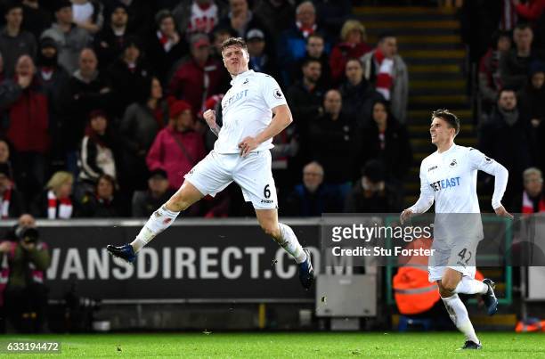 Alfie Mawson of Swansea City celebrates scoring the opening goal during the Premier League match between Swansea City and Southampton at Liberty...