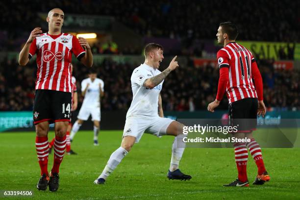 Alfie Mawson of Swansea City celebrates scoring the opening goal during the Premier League match between Swansea City and Southampton at Liberty...