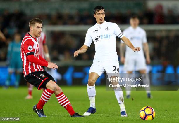 Steven Davis of Southampton and Jack Cork of Swansea City compete for the ball during the Premier League match between Swansea City and Southampton...