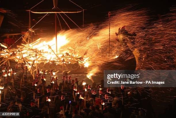 Members of the Jarl Squad set fire to their Viking longship during the Up Helly Aa Viking festival in Lerwick on the Shetland Isles.