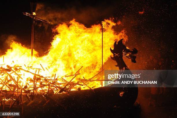 Participants dressed as Vikings burn their viking galley ship at the culmination of the annual Up Helly Aa festival in Lerwick, Shetland Islands, on...