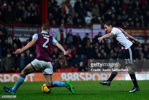 Lasse Vibe of Brentford FC scores the third Brentford goal during the Sky Bet Championship match between Brentford and Aston Villa at Griffin Park on...