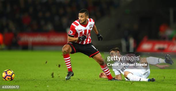 Sofiane Boufal of Southampton and Angel Rangel of Swansea City compete for the ball during the Premier League match between Swansea City and...