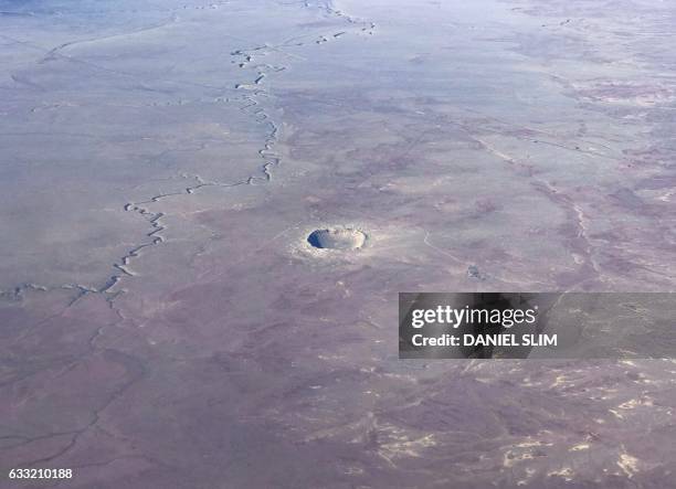 The Meteor Crater near Winslow, Arizona, is seen from a plane Januray 30, 2017. The Meteor Crater, sometimes known as the Barringer Crater and...