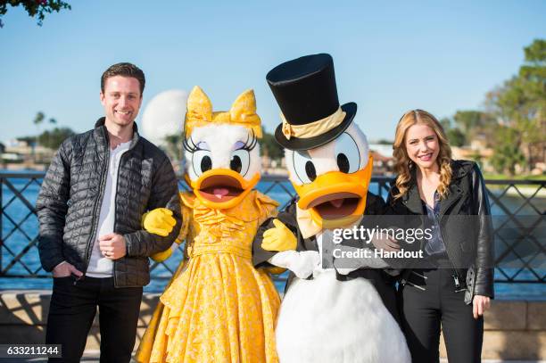 In this handout photo provided by Disney Parks, Broadway stars Kevin Massey and Kerry Butler pose with Donald Duck and Daisy Duck January 30, 2017 at...