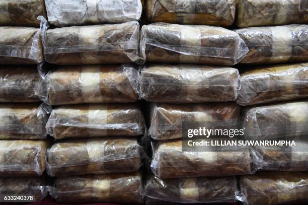 Bags of "yaba" tablets, or methamphetamine mixed with caffeine, are displayed for the media in front of the Narcotics Suppression Division in Bangkok...